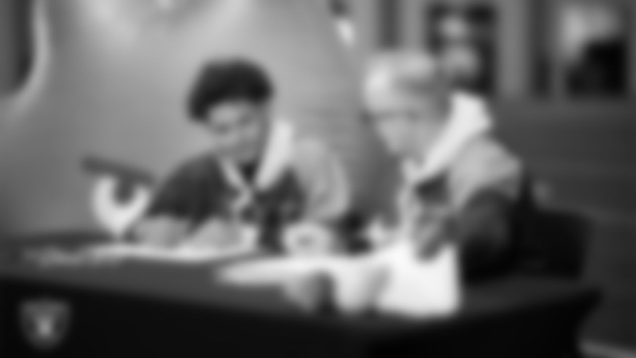 Intermountain Health Regional President Mitch Cloward designs custom shoes for My Cause My Cleats with Intermountain Children's Health patient Aiden at Intermountain Health Performance Center.