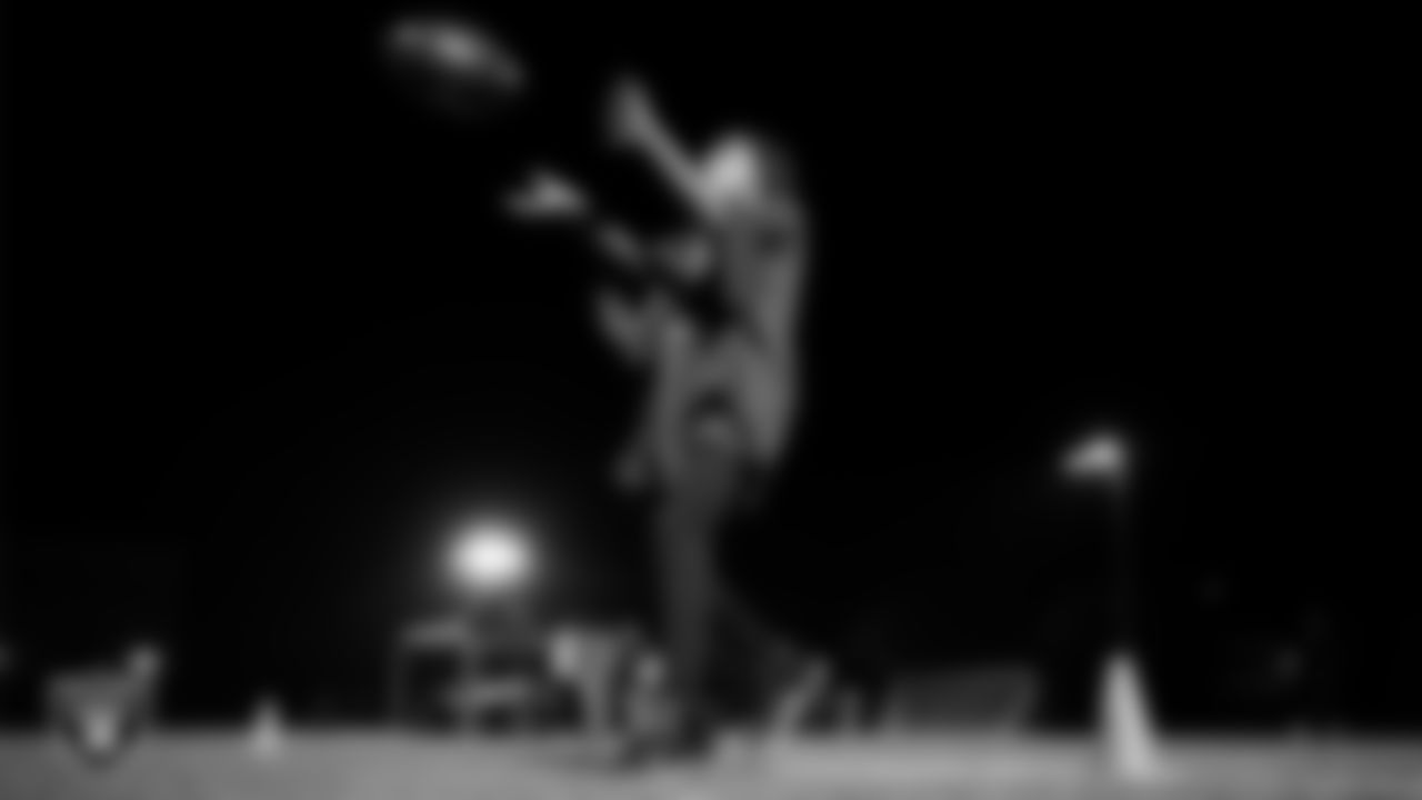 An athlete takes part in a Silver and Black League flag football clinic at Bill and Lillie Heinrich YMCA.