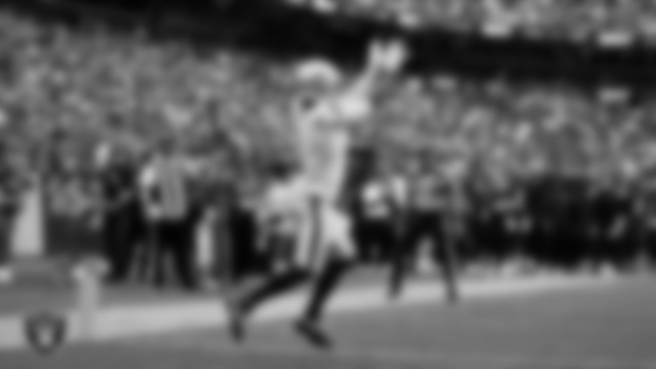 Las Vegas Raiders wide receiver Tre Tucker (1) goes for a 10-yard touchdown catch during the regular season away game against the Washington Commanders at Northwest Stadium.
