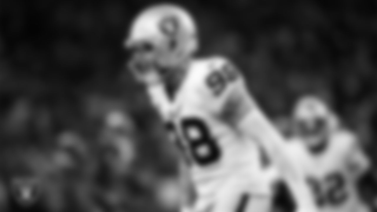 Las Vegas Raiders defensive end Maxx Crosby (98) celebrates after making a tackle during the regular season away game against the Houston Texans at NRG Stadium.