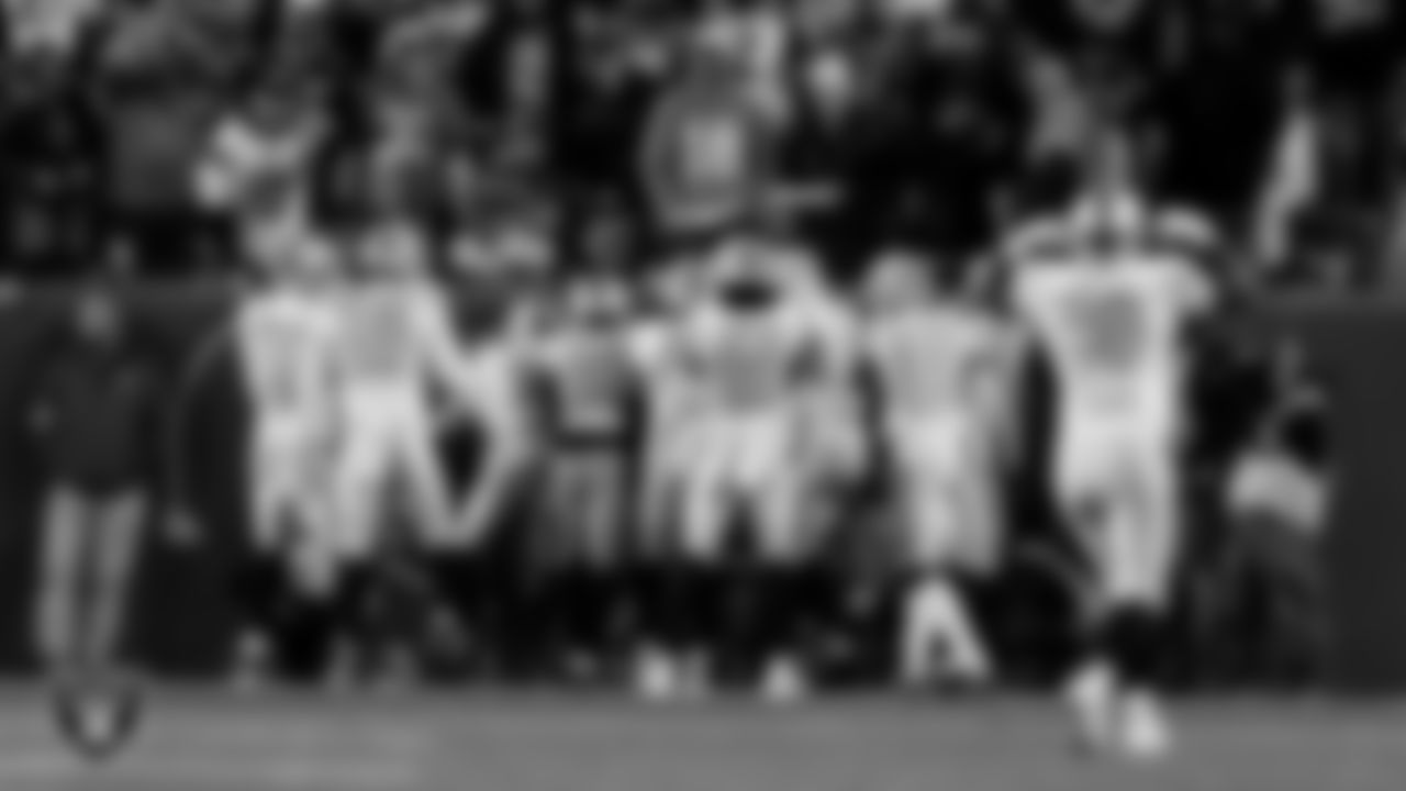 Las Vegas Raiders cornerback Kyu Blu Kelly (36) celebrates with teammates after intercepting a pass during the regular season away game against the Denver Broncos at Empower Field at Mile High.