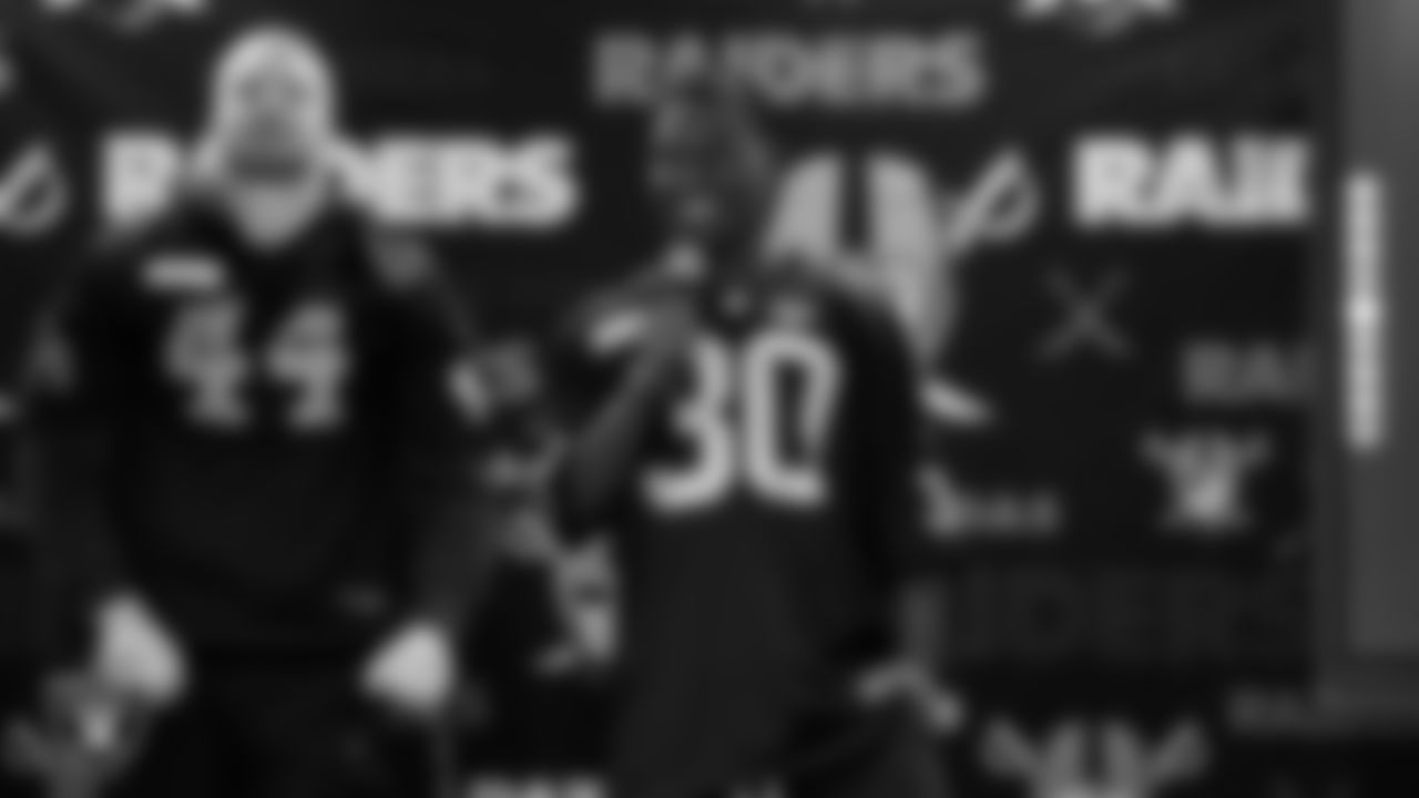 Las Vegas Raiders cornerback Darnay Holmes (30) speaks to students during a Raiders Spirit Day at Richard H. Bryan Elementary School.