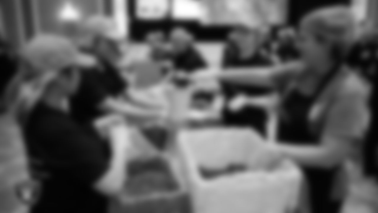 Volunteers pack meals during a Feed the Funnel Party at Wynn Las Vegas.