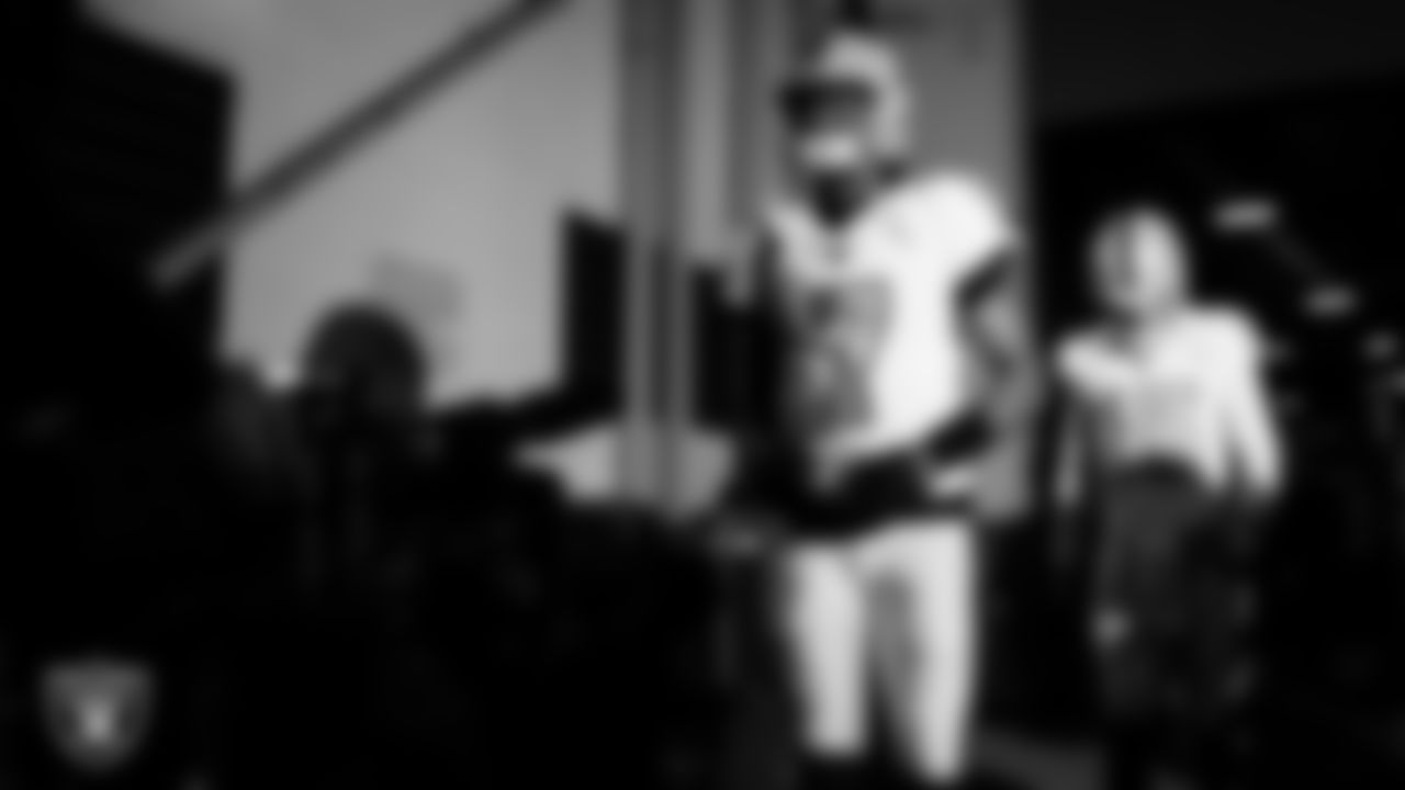 Las Vegas Raiders quarterback Geno Smith (7) walks down the tunnel before the regular season away game against the Denver Broncos at Empower Field at Mile High.