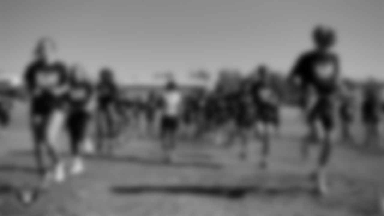 Athletes take part in a drill after a partnership announcement between the Las Vegas Raiders and Clark County School District as a Silver and Black Flag Football league at the middle school level at Sig Rogich Middle School.