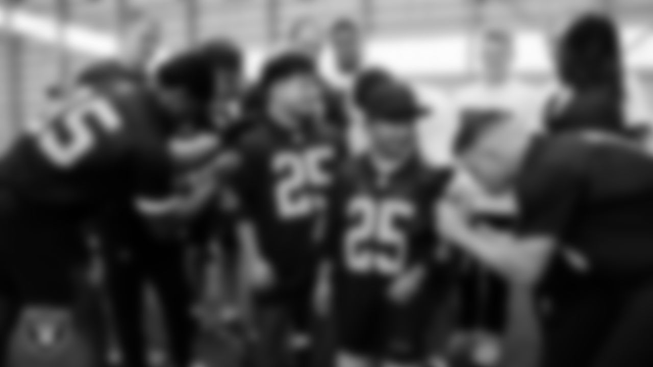 Marcos Carrillo and Christopher Arias from Make-A-Wish get their jerseys signed after practice during a visit to Intermountain Health Performance Center.