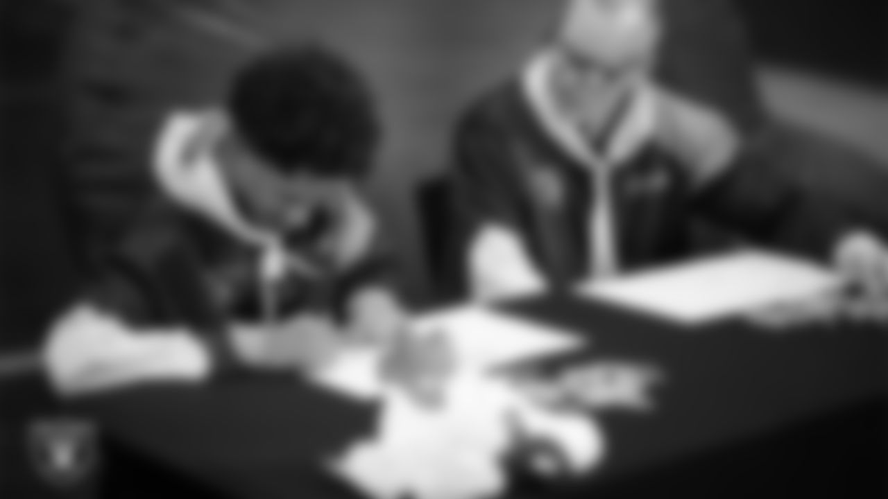 Intermountain Health Regional President Mitch Cloward designs custom shoes for My Cause My Cleats with Intermountain Children's Health patient Aiden at Intermountain Health Performance Center.