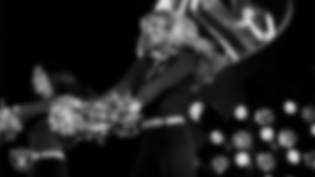 Raiderette Cori performs with rapper and record producer Lil Jon during halftime at the Las Vegas Raiders regular season home game against the Los Angeles Chargers at Allegiant Stadium.