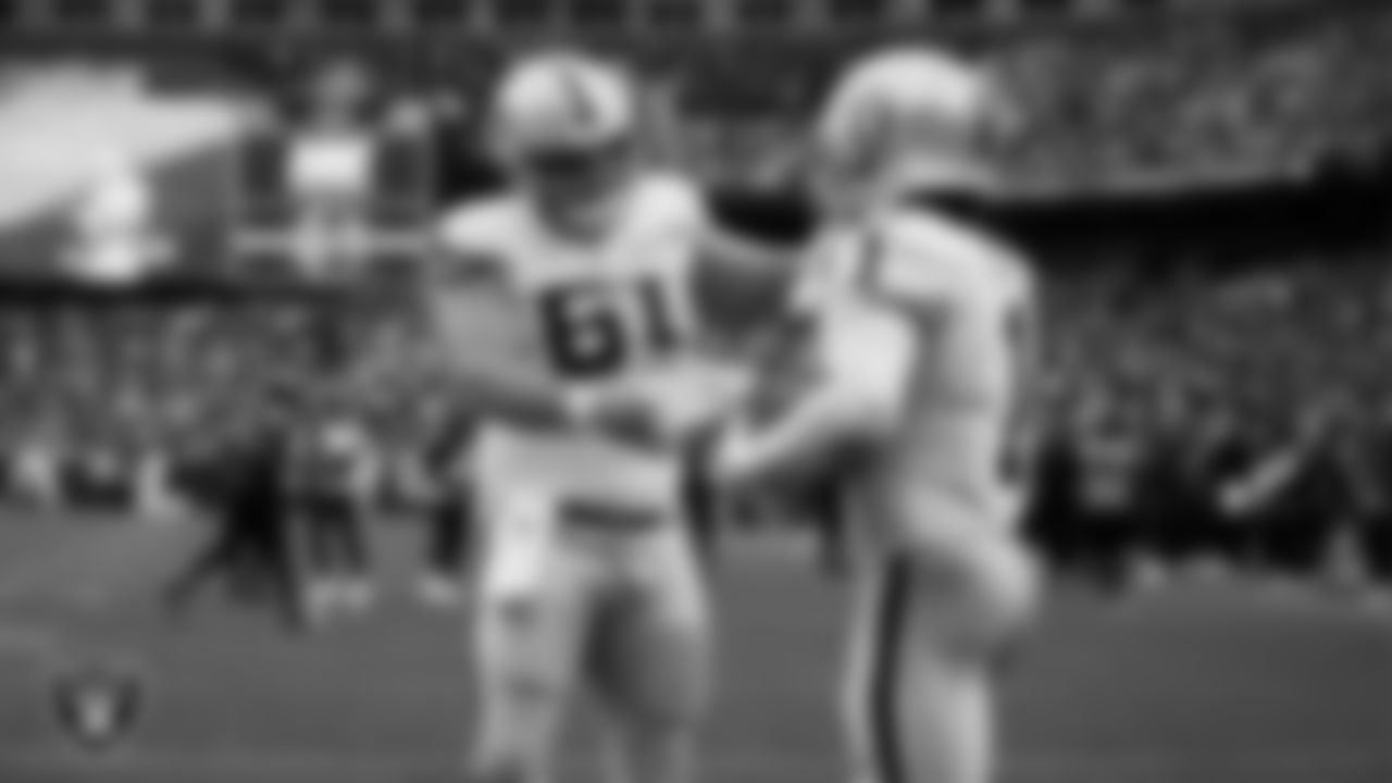 Las Vegas Raiders wide receiver Tre Tucker (1) celebrates with center/guard Jordan Meredith (61) after making a 10-yard touchdown catch during the regular season away game against the Washington Commanders at Northwest Stadium.