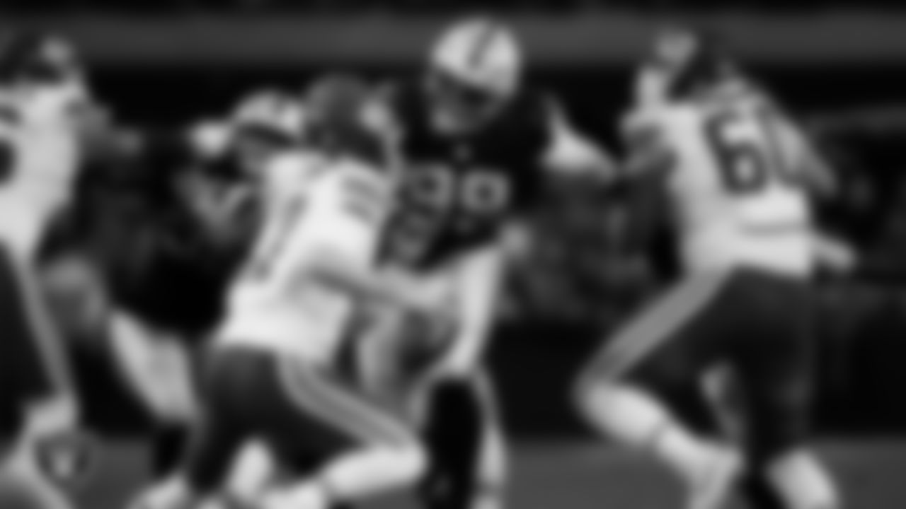 Las Vegas Raiders defensive tackle Thomas Booker IV (99) pressures the quarterback during the regular season home game against the Kansas City Chiefs at Allegiant Stadium.