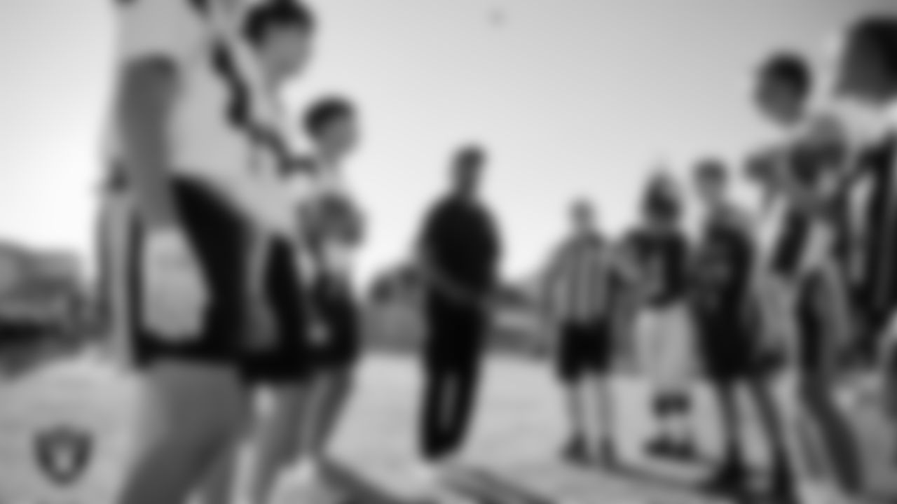 Las Vegas Raiders alumnus Leo Gray during the coin toss before the Las Vegas Raiders' Middle School Flag Football Showcase game at Ralph Cadwallader Middle School.