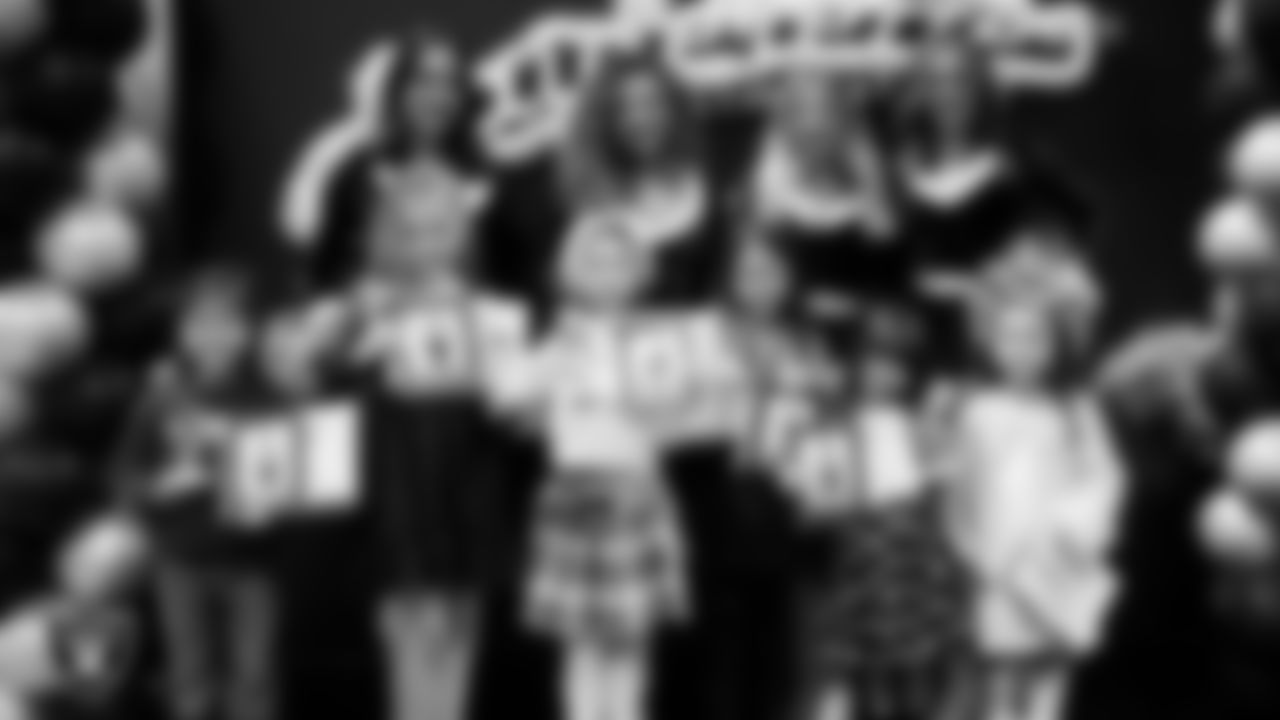 Raiderettes pose for a photo with Junior Raiderettes during the Junior Raiderettes Banquet at The Studio.