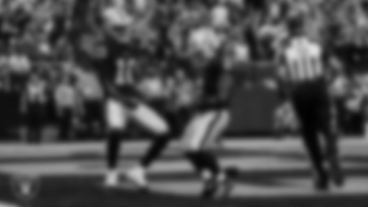 Las Vegas Raiders running back Ashton Jeanty (2) celebrates with wide receiver Dont'e Thornton Jr. (10) after making a 9-yard touchdown catch during the regular season home game against the Chicago Bears at Allegiant Stadium.