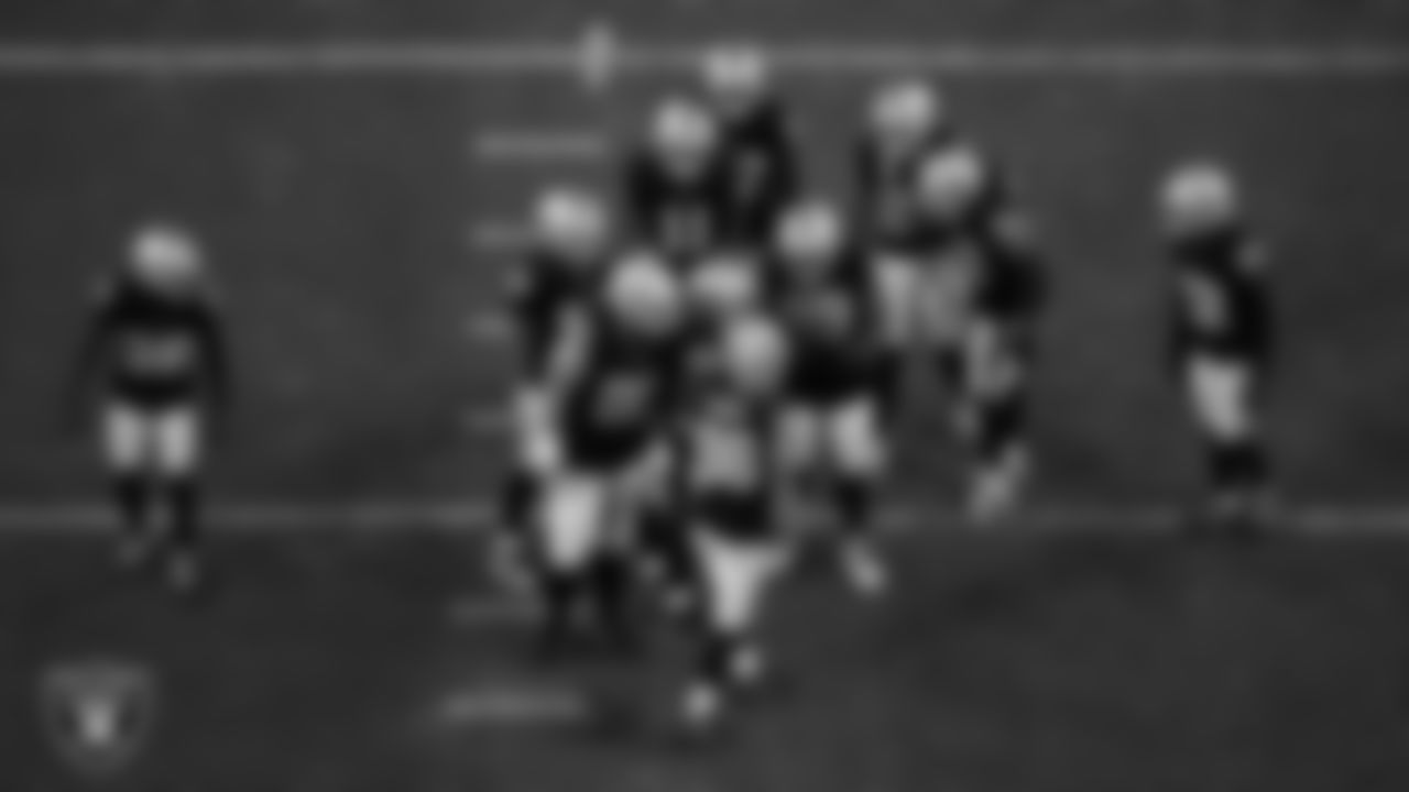The Las Vegas Raiders defense huddles during the regular season home game against the Los Angeles Chargers at Allegiant Stadium.