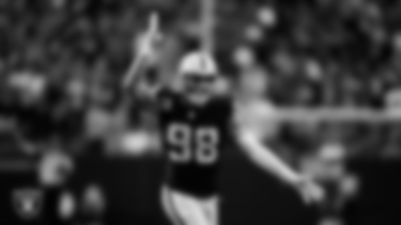 Las Vegas Raiders defensive end Maxx Crosby (98) celebrates after sacking the quarterback during the regular season home game against the Tennessee Titans at Allegiant Stadium.