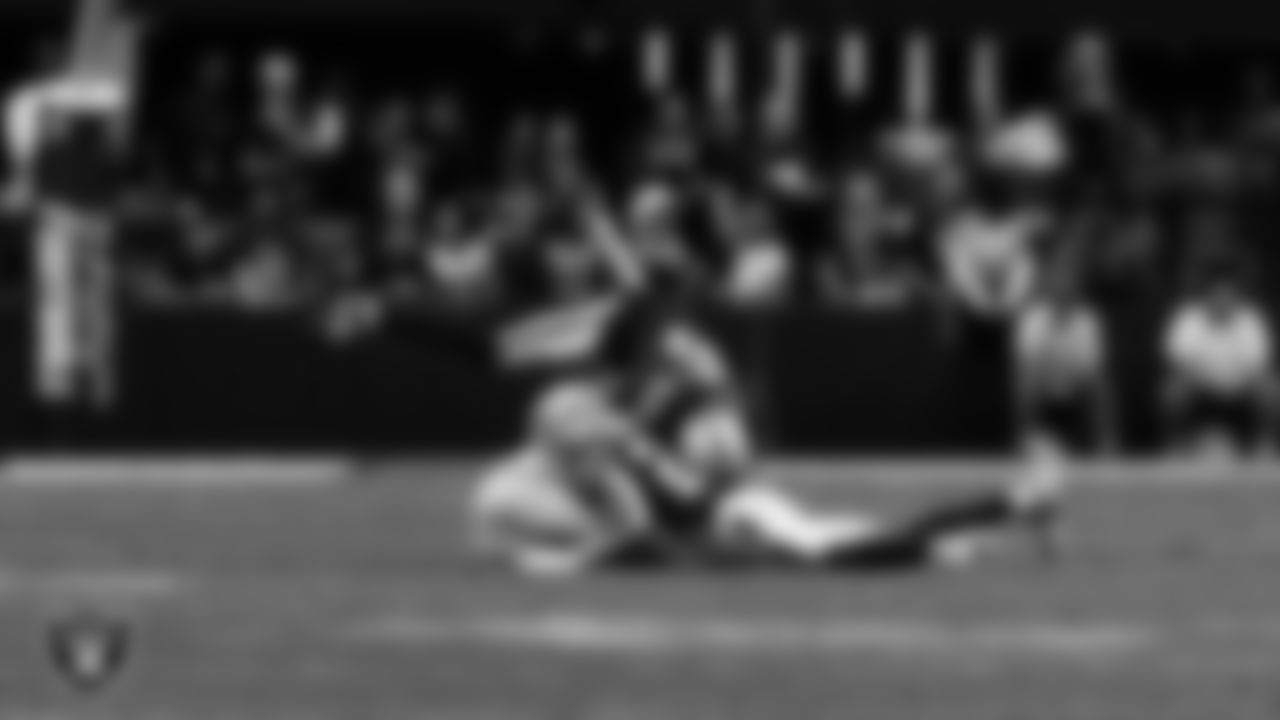 Las Vegas Raiders safety Isaiah Pola-Mao (20) and cornerback Kyu Blu Kelly (36) make a tackle during the preseason home game against the San Francisco 49ers at Allegiant Stadium.