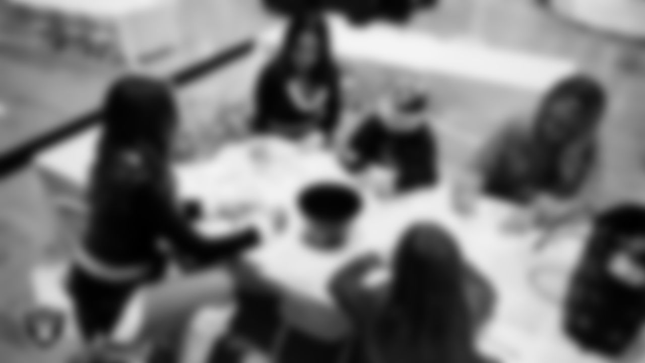 Raiderettes Shelby and Reagan and Junior Raiderettes enjoy activities during the Junior Raiderettes Banquet at The Studio.