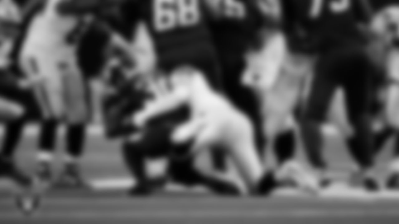 Las Vegas Raiders defensive end Maxx Crosby (98) makes a tackle during the regular season away game against the Los Angeles Chargers at SoFi Stadium.