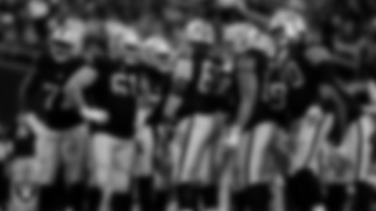 The Las Vegas Raiders huddle during the regular season home game against the Cleveland Browns at Allegiant Stadium.