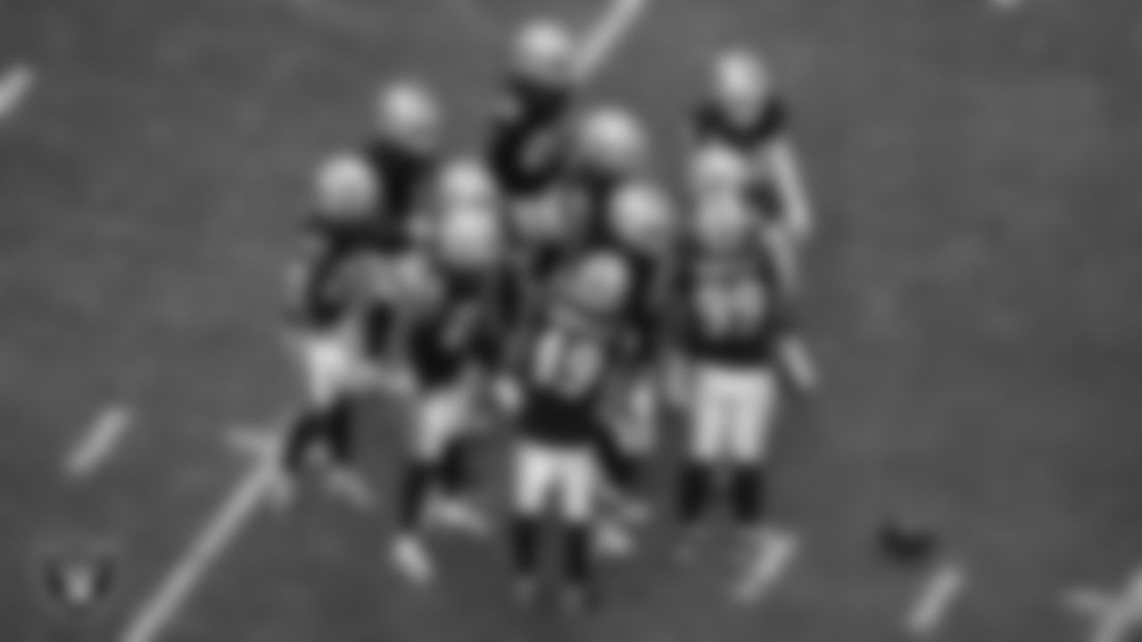 The Las Vegas Raiders defense huddles during the regular season home game against the Cleveland Browns at Allegiant Stadium.