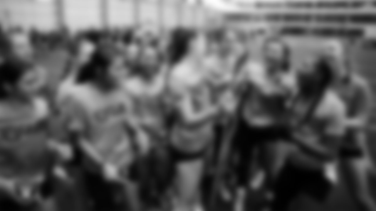 The winner of the Fastest Woman competition celebrates with teammates during a Nike 11-On event at Intermountain Health Performance Center.