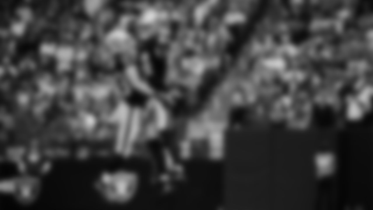 Las Vegas Raiders running back Dylan Laube (23) celebrates with teammates after making a tackle during the regular season home game against the Denver Broncos at Allegiant Stadium.