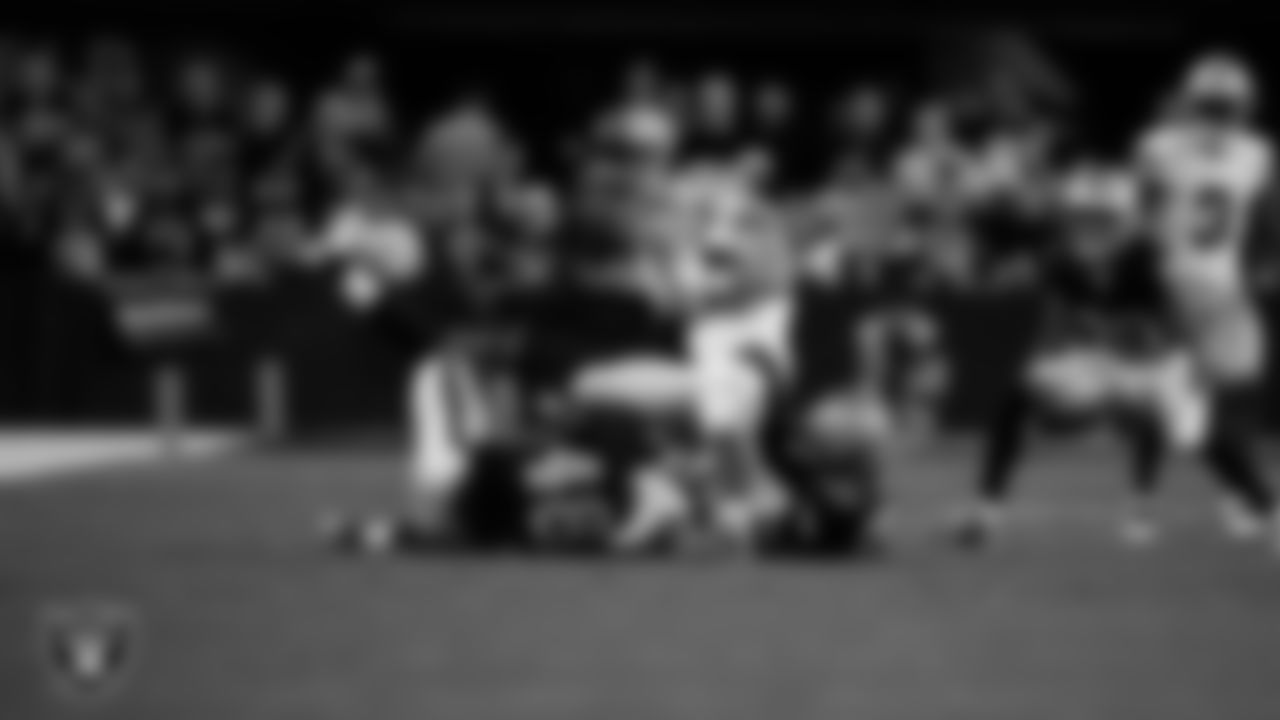 Las Vegas Raiders linebacker Jamin Davis (48) and cornerback Kyu Blu Kelly (36) make a tackle during the regular season home game against the Dallas Cowboys at Allegiant Stadium.