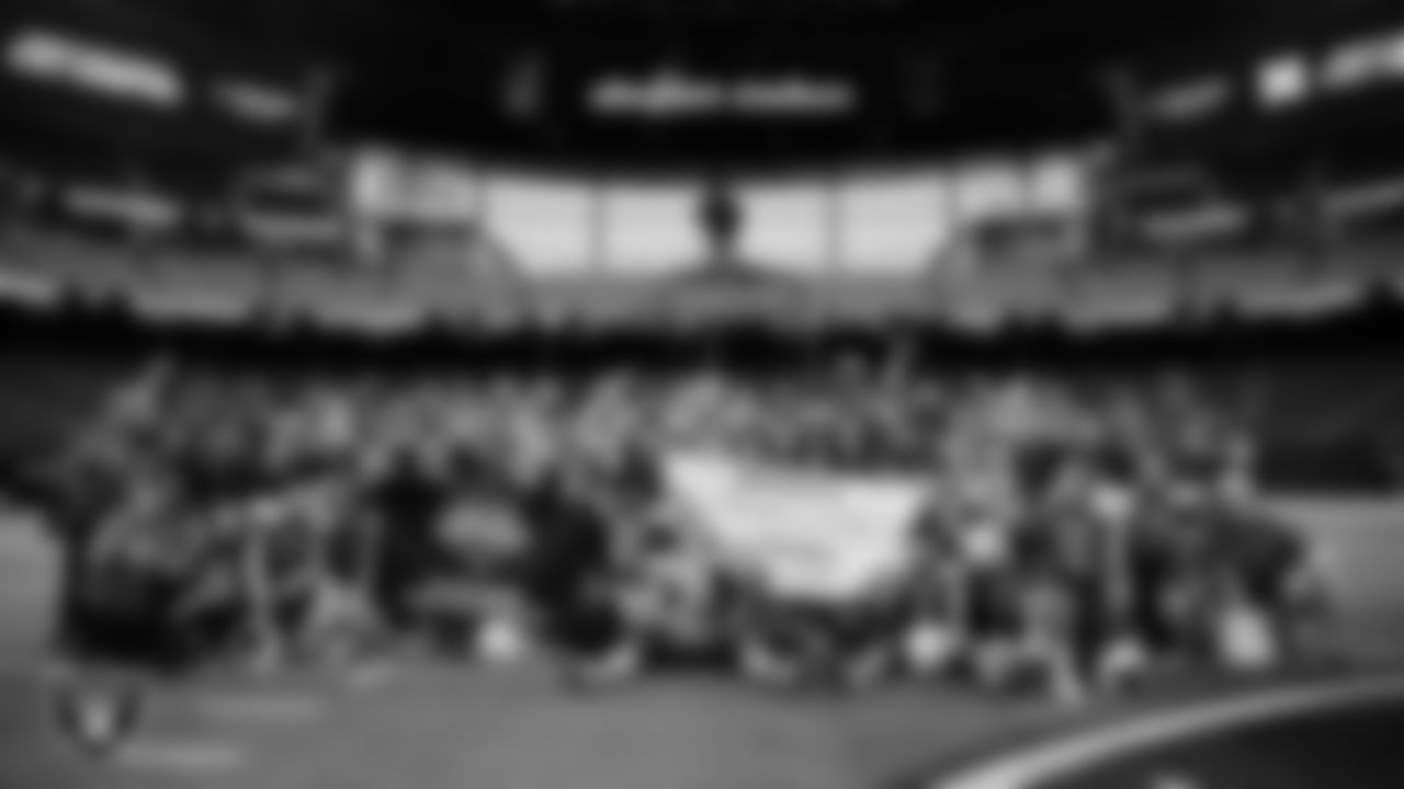 The Needles High School football team poses for a photo after defeating Pershing County High School in the NIAA 2A Division State Championship game at Allegiant Stadium.