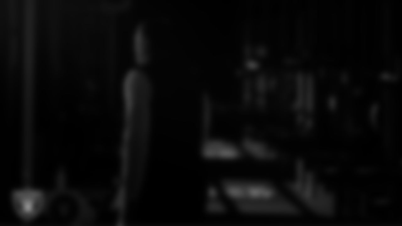 Las Vegas Raiders defensive assistant/linebackers coach Ty McKenzie walks out to the field for practice at Intermountain Health Performance Center.