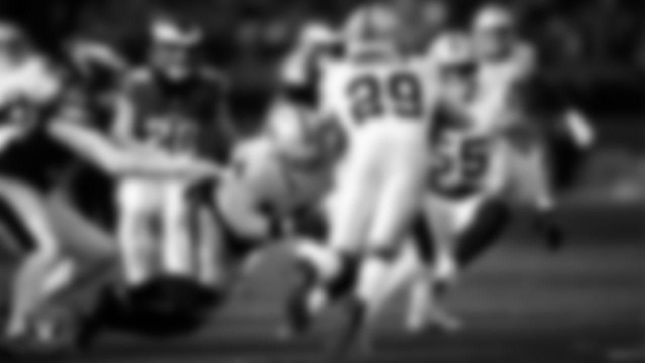 Las Vegas Raiders linebacker Tommy Eichenberg (44) and cornerback Chigozie Anusiem (29) make a tackle during the regular season away game against the Philadelphia Eagles at Lincoln Financial Field.