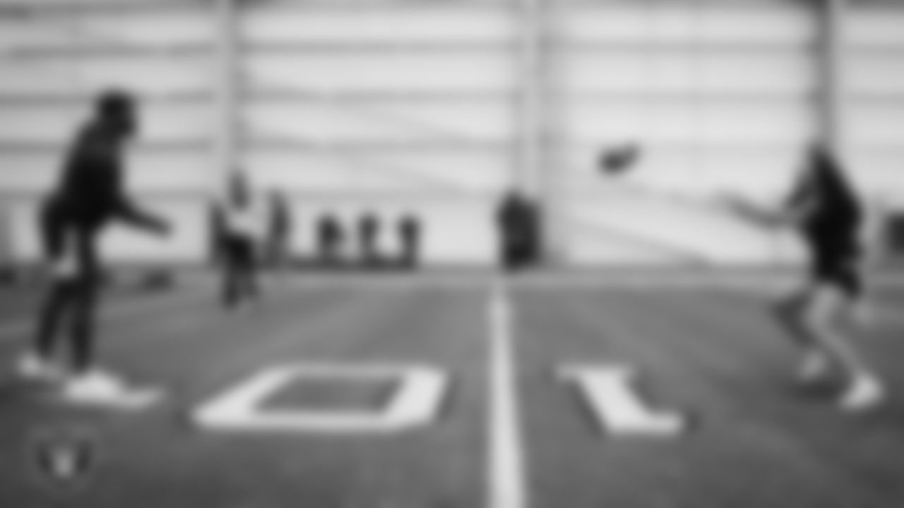 A member of the Jackson State University football team helps on a drill during a Raiders Junior Training Camp at Intermountain Health Performance Center.