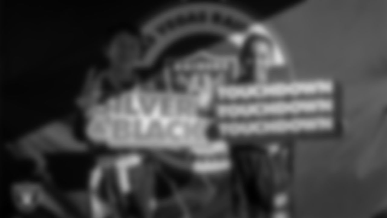 Athletes pose for a photo during Silver and Black Saturday at Liberty High School.