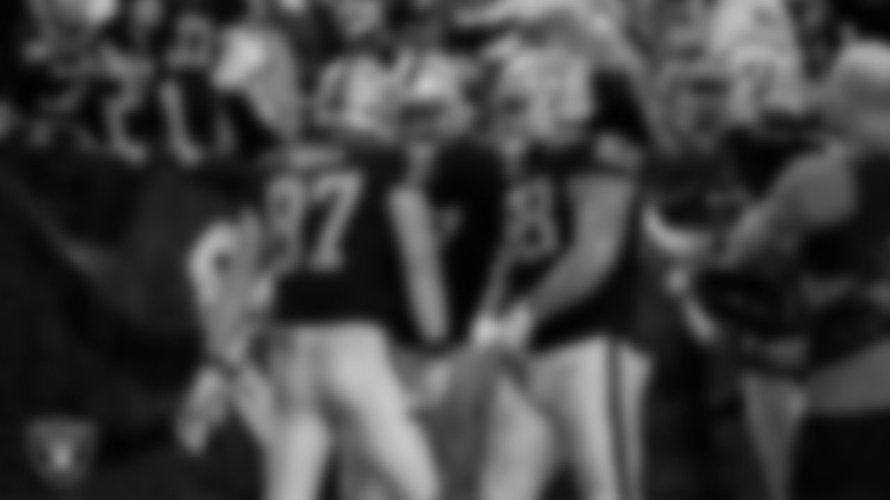 Las Vegas Raiders tight end Michael Mayer (87) is congratulated after making a 7-yard touchdown catch during the regular season home game against the New York Jets at Allegiant Stadium.