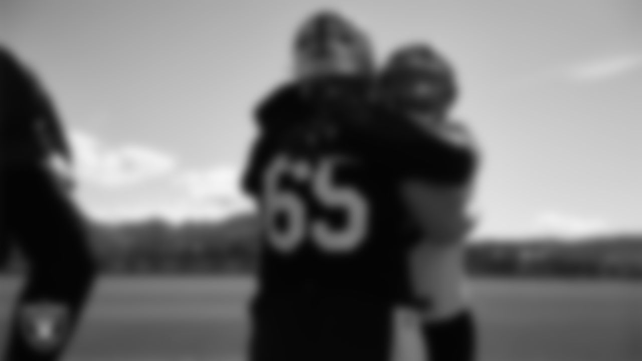 Las Vegas Raiders guard Alex Cappa (65) and linebacker Devin White (45) during practice at Intermountain Health Performance Center.