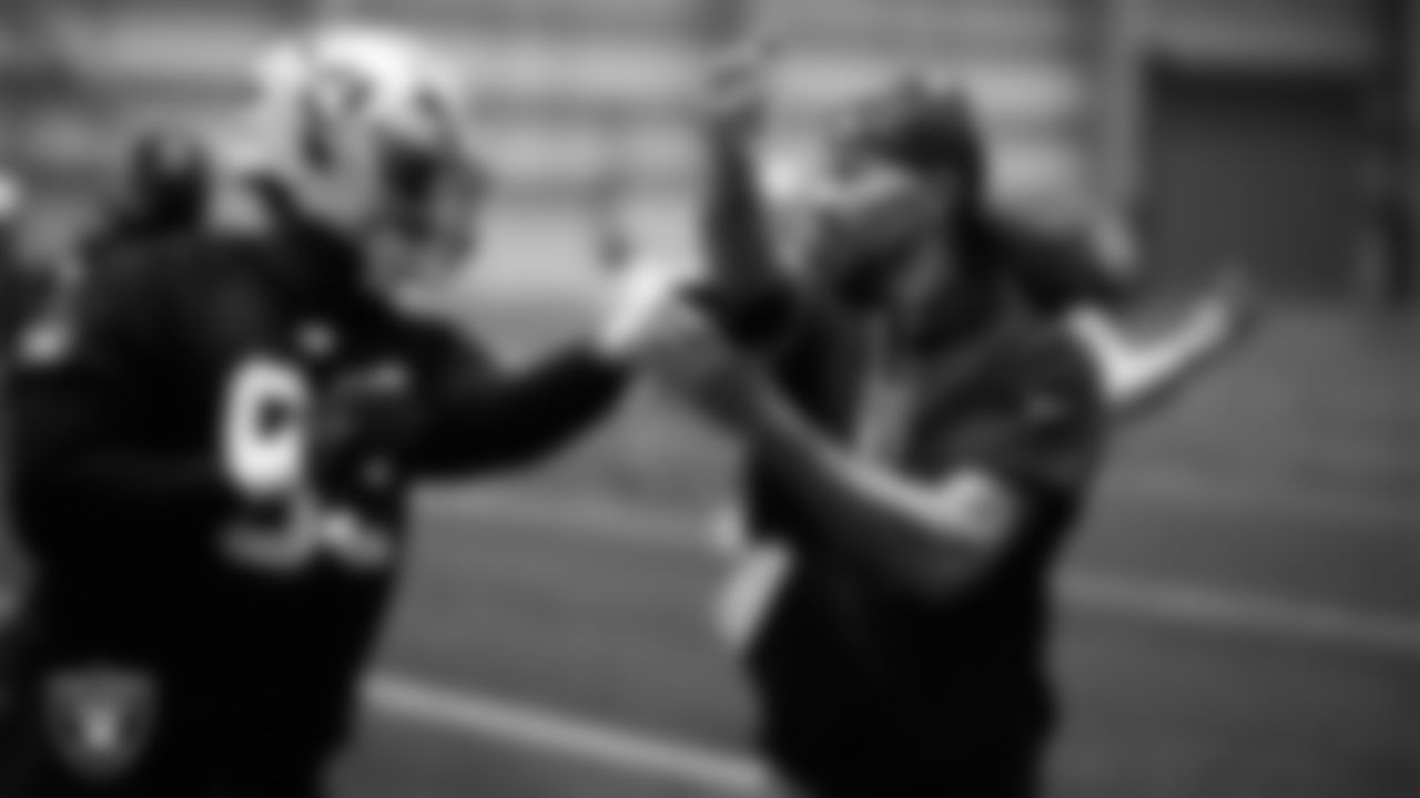 Las Vegas Raiders defensive tackle Zach Carter (93) and run game coordinator/defensive line coach Rob Leonard at an Organized Team Activity (OTA) at Intermountain Health Performance Center.