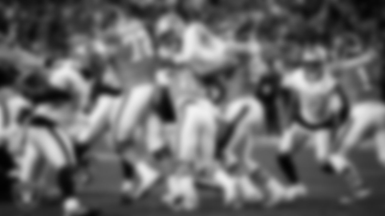 Las Vegas Raiders defensive end Maxx Crosby (98) makes a tackle during the regular season away game against the Denver Broncos at Empower Field at Mile High.