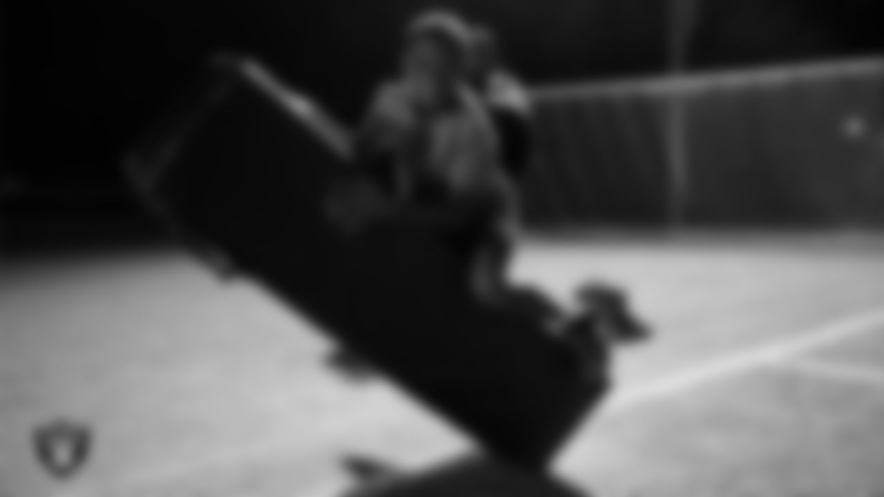 An athlete takes part in a Silver and Black League flag football clinic at Bill and Lillie Heinrich YMCA.