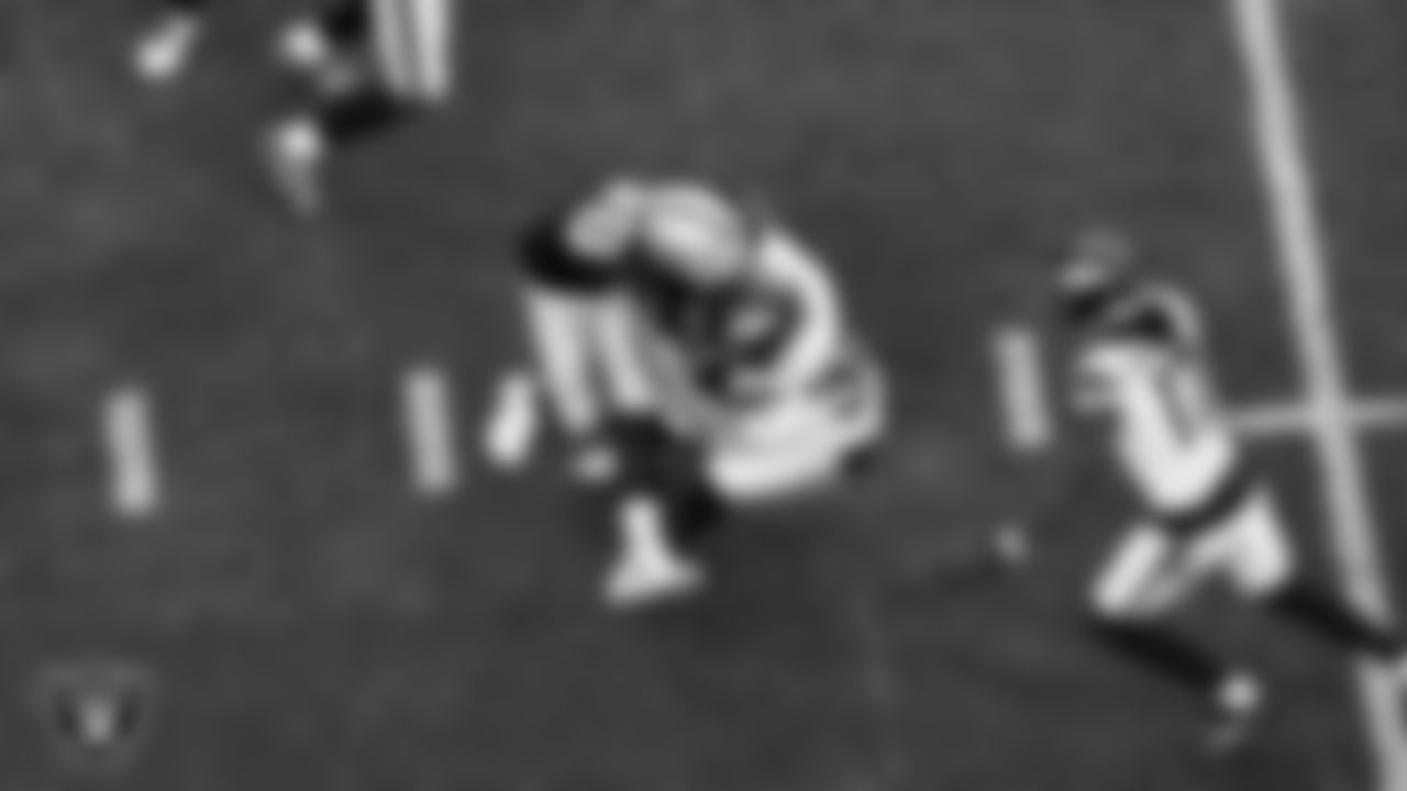 Las Vegas Raiders defensive end Maxx Crosby (98) makes a tackle during the regular season home game against the Denver Broncos at Allegiant Stadium.