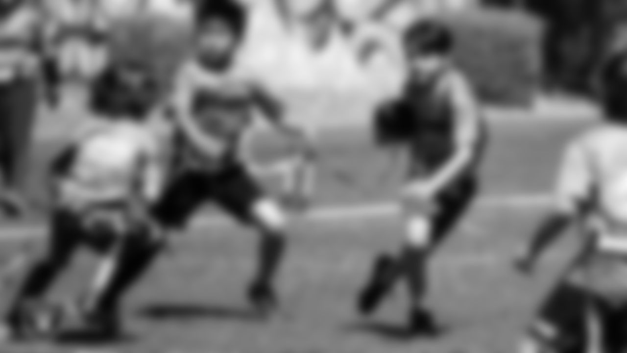 Athletes competes in a Silver and Black Flag Football game at Bill and Lillie Heinrich YMCA.