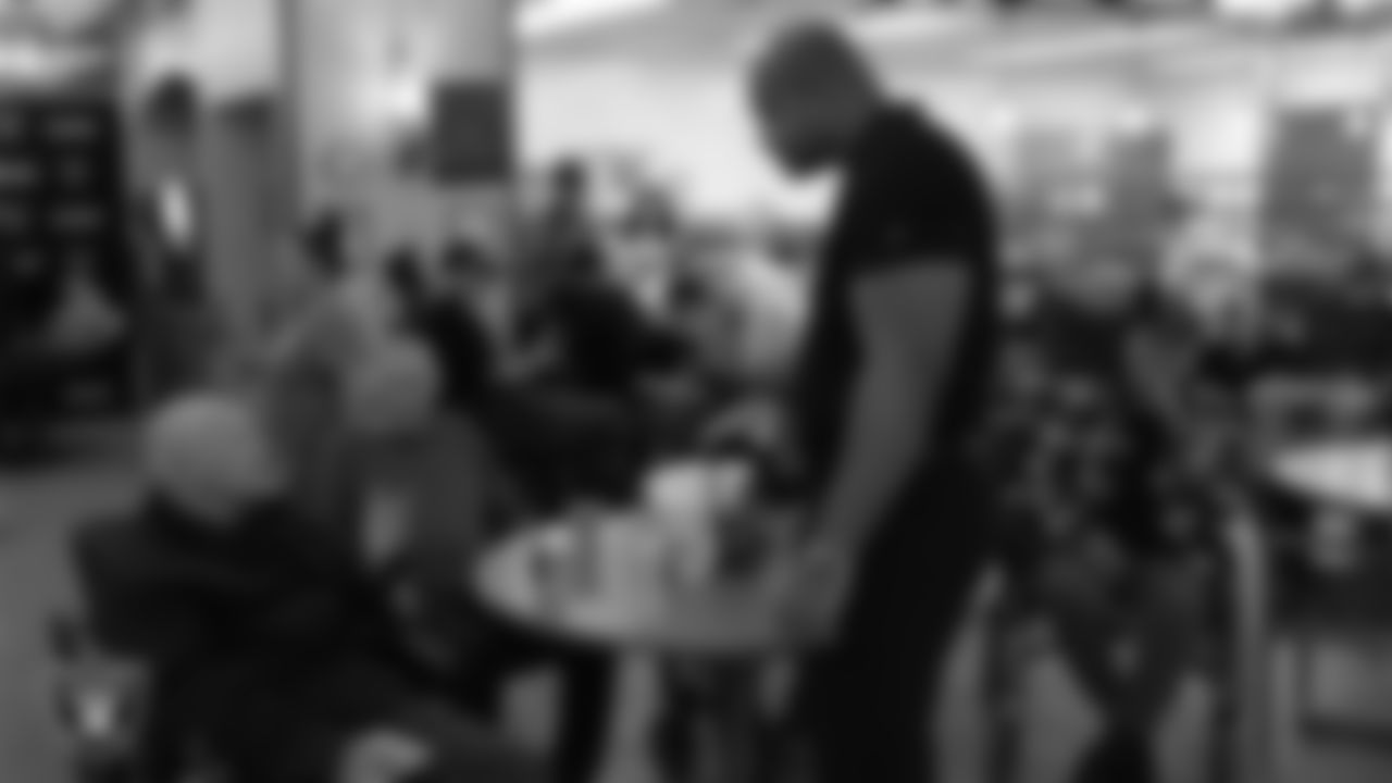 Las Vegas Raiders alumnus Grant Irons speaks to a veteran during the annual Cox Salute to Service Tailgate at Southern Nevada State Veterans Home.