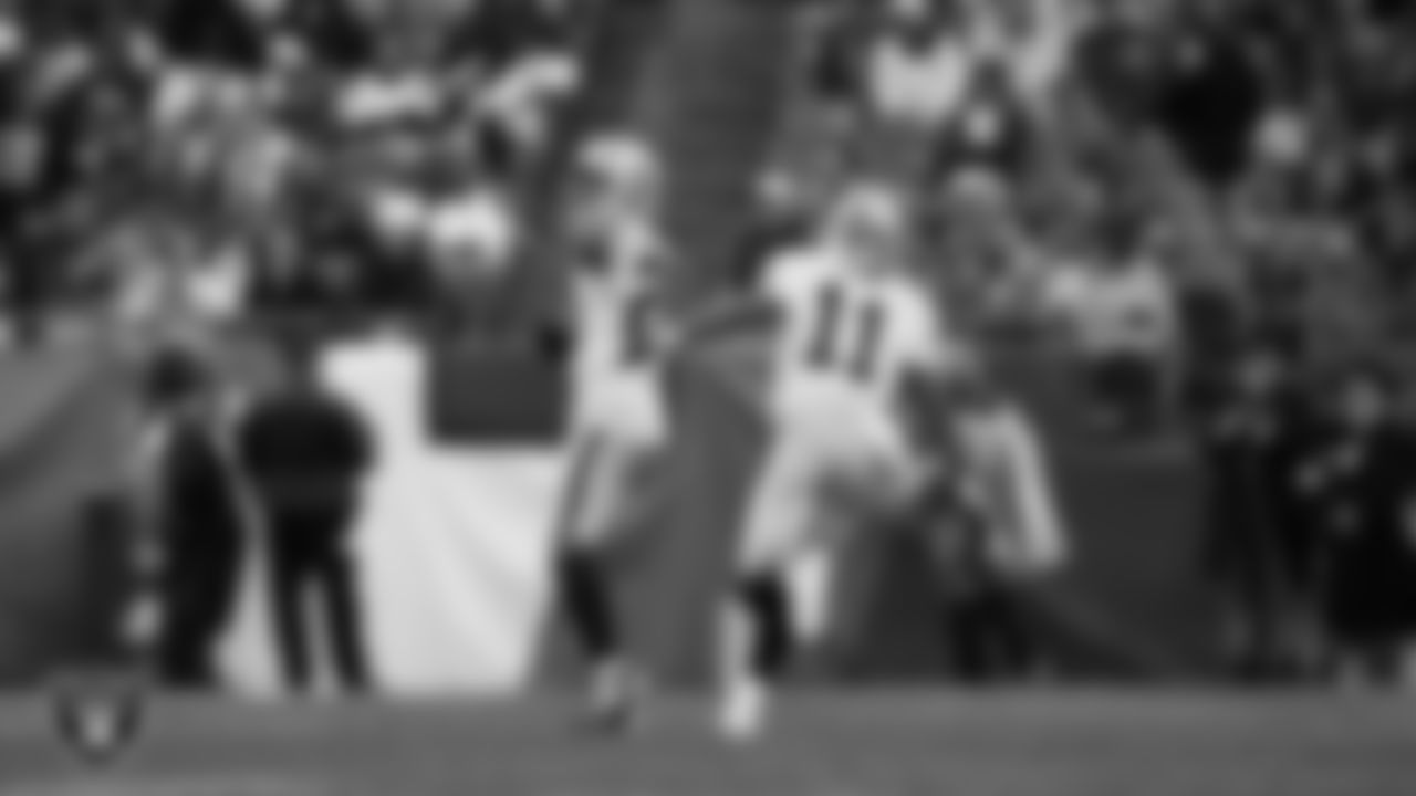 Las Vegas Raiders safety Isaiah Pola-Mao (20) celebrates after intercepting a pass during the regular season away game against the New England Patriots at Gillette Stadium.