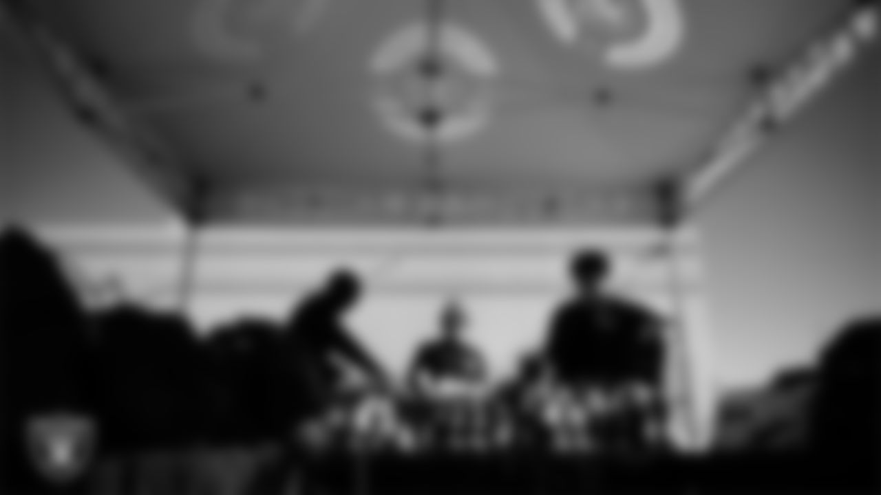 Las Vegas Raiders ambassadors organize equipment during the Raiders' Equipment Blitz at Intermountain Health Performance Center.