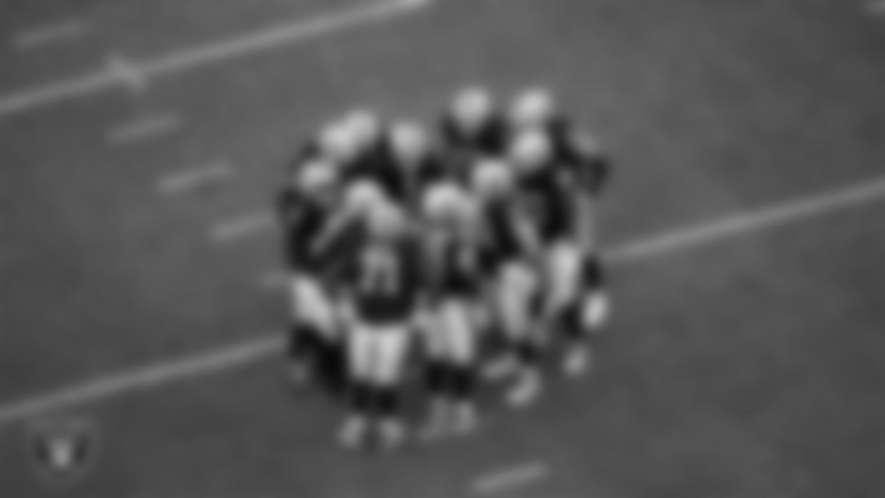 The Las Vegas Raiders offense huddles during the preseason home game against the San Francisco 49ers at Allegiant Stadium.