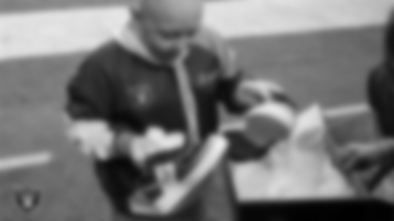 Intermountain Children's Health patient Isaak unboxes his custom shoes for the NFL's My Cause My Cleats initiative before the Las Vegas Raiders' regular season home game against the Cleveland Browns at Allegiant Stadium.