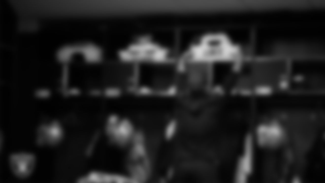 Las Vegas Raiders equipment assistant Ben Silva in the locker room prior to the Raiders' arrival for their regular season away game against the Kansas City Chiefs at GEHA Field at Arrowhead Stadium.