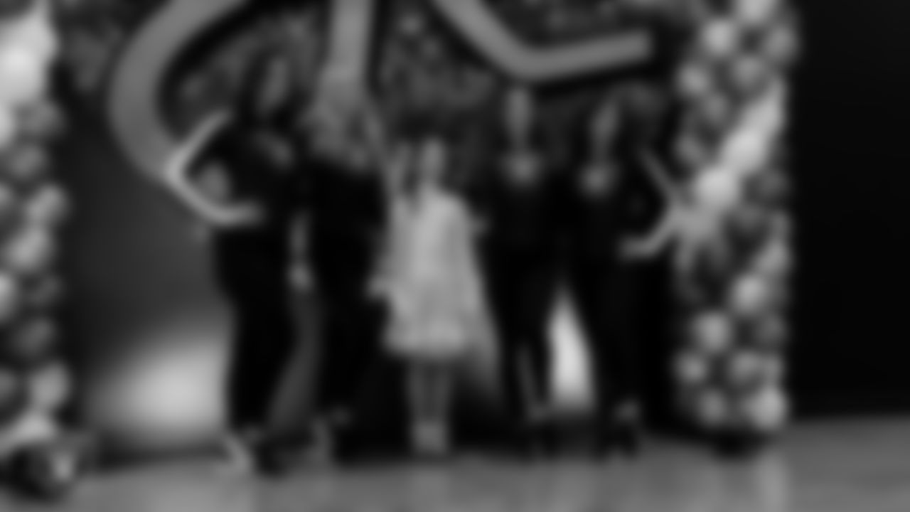 Raiderettes Reagan, Delaney, Lexie and Ashtin pose for a photo with an attendee during the Valentine's Day Dance at The Studio.