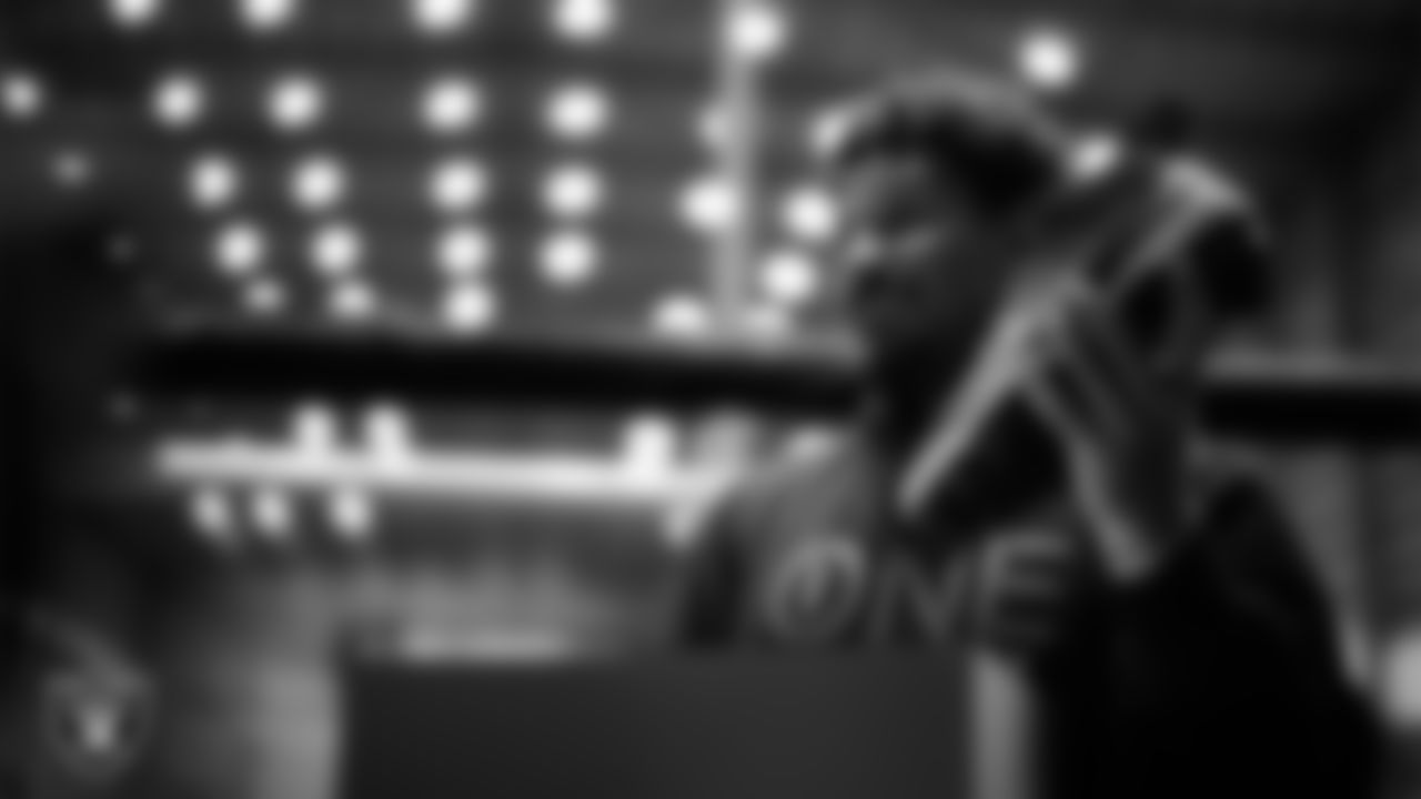 Las Vegas Raiders guard Caleb Rogers (76) unboxes his custom cleats for the NFL's My Cause My Cleats initiative at Intermountain Health Performance Center.