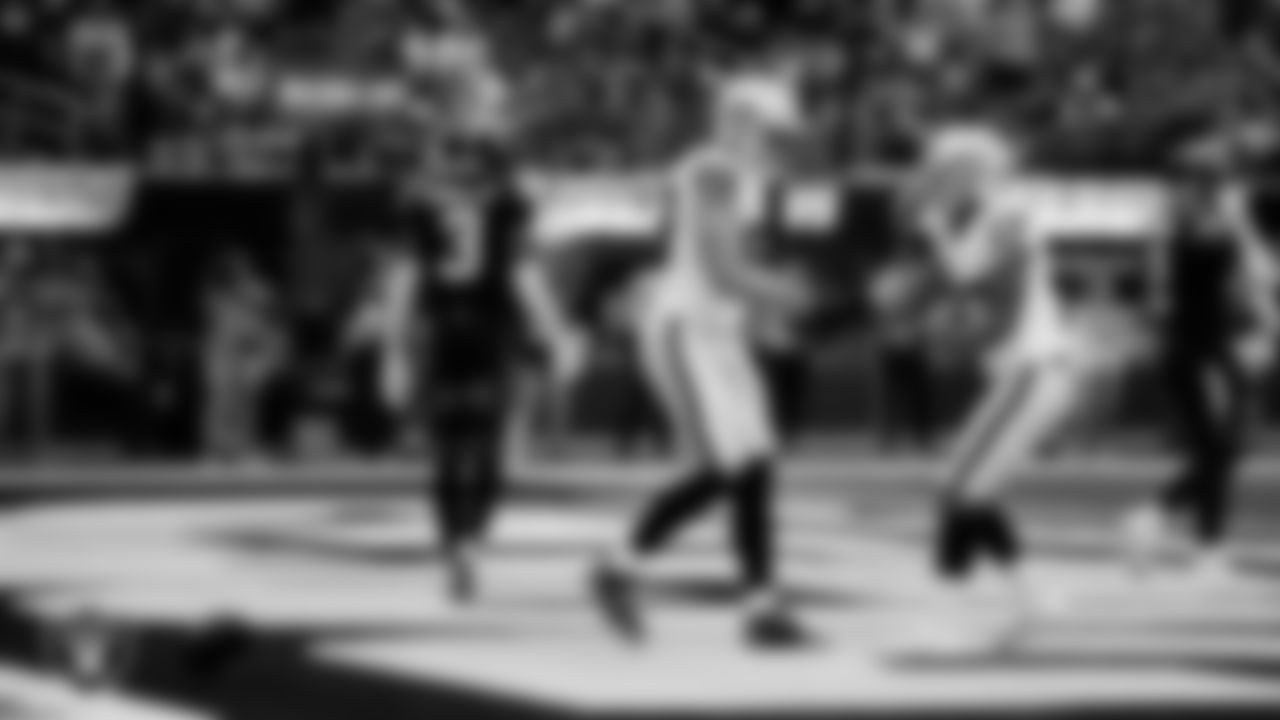 Las Vegas Raiders tight end Brock Bowers (89) celebrates with wide receiver Tyler Lockett (17) after making a 6-yard touchdown catch during the regular season away game against the Los Angeles Chargers at SoFi Stadium.