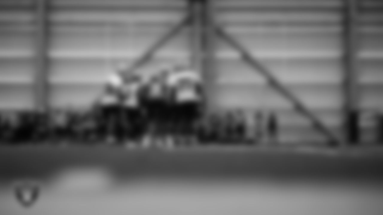 The Las Vegas Raiders huddle at an Organized Team Activity (OTA) at Intermountain Health Performance Center.