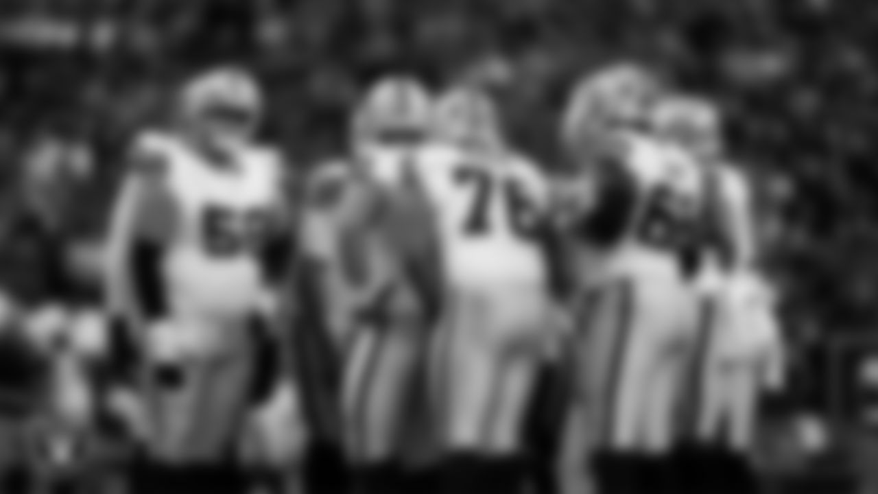 The Las Vegas Raiders huddle during the preseason away game against the Seattle Seahawks at Lumen Field.